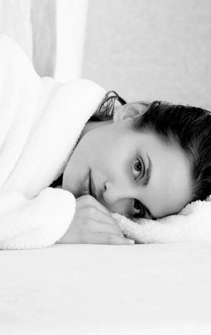 Woman laying down in robe