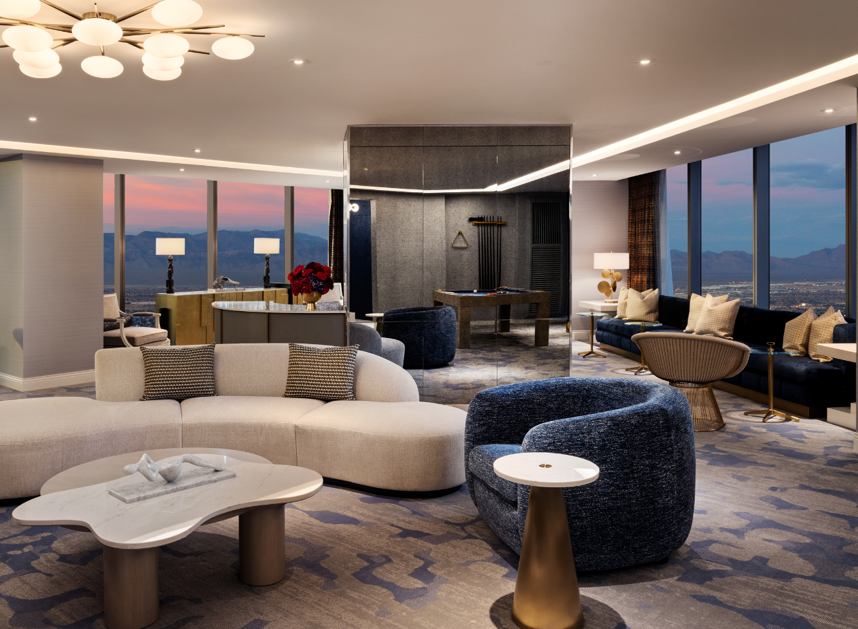 Seating area with mini bar, billiard table and chairs underneath a light fixture