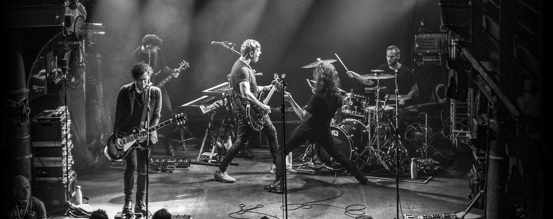 Third Eye Blind band playing on stage with 4 guitarists and drummer