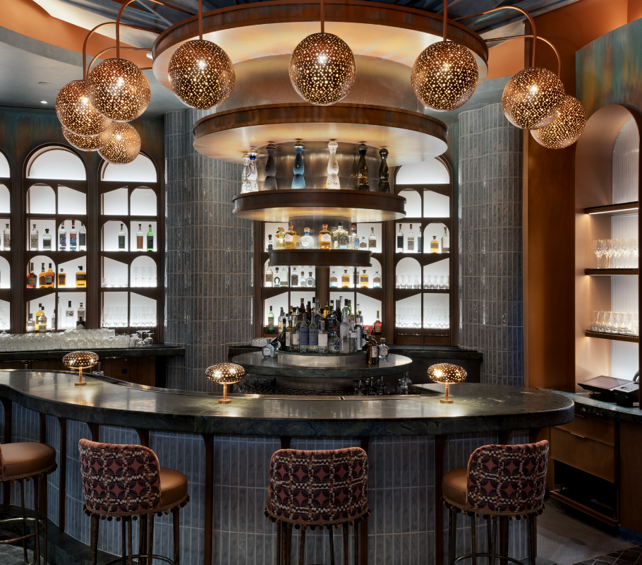 Bartop with colorful chairs underneath metal light features