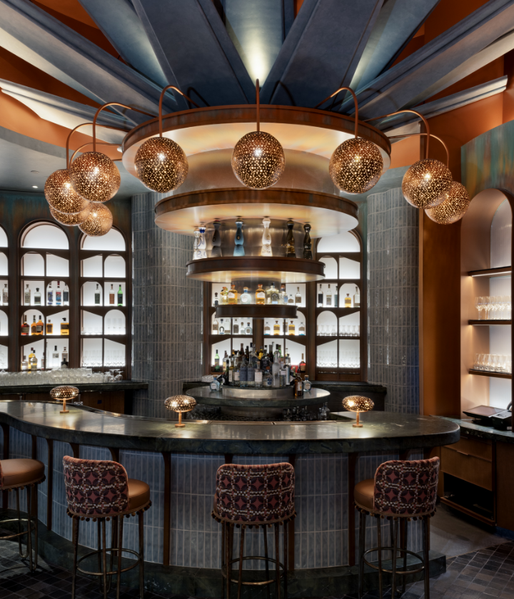 Bartop with colorful chairs underneath metal light features