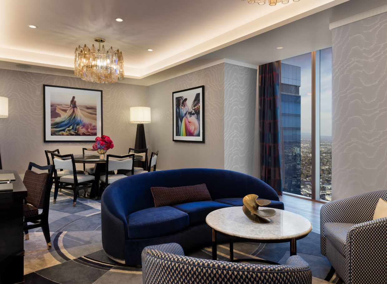 Dining table, seating area underneath chandeliers