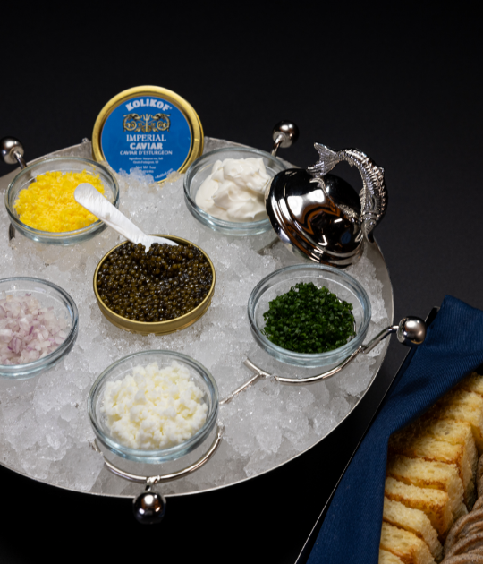 6 jars of caviars arranged over ice in a bowl