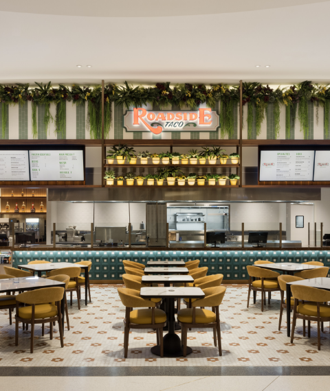 Roadside Taco sign logo in the quick service restaurant area with seating