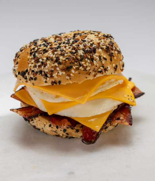 Everything bagel sandwich with eggs, cheese, and bacon