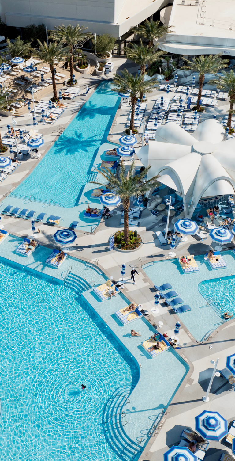 Birds eye pool layout with lounges, cabanas and bar