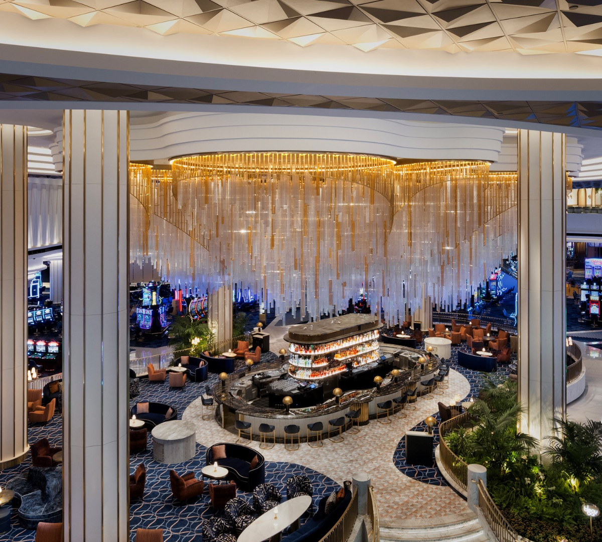 Second story vantage point of chandelier over Bleau bar with seating