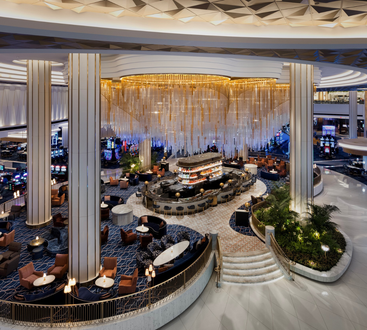 Second story vantage point of chandelier over Bleau bar with seating