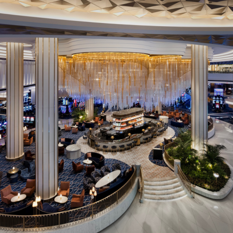 Second story vantage point of chandelier over Bleau bar with seating