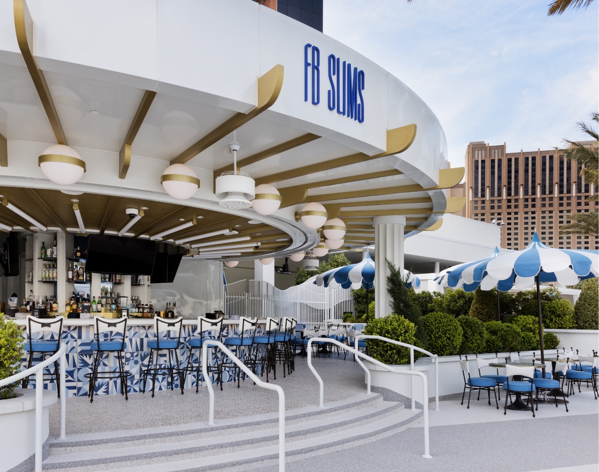 Exterior FB Slims sign above bar and seating area