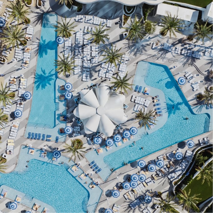 Overhead pool layout with lounges, cabanas and bar