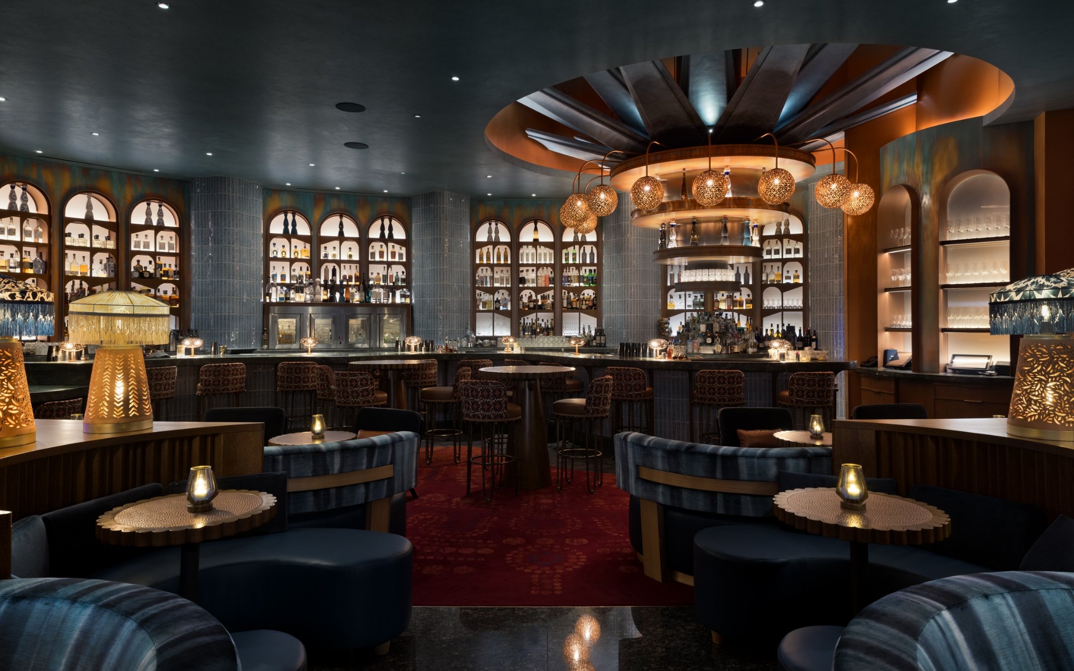 Bar seating area with liquor display wall and decorative elements