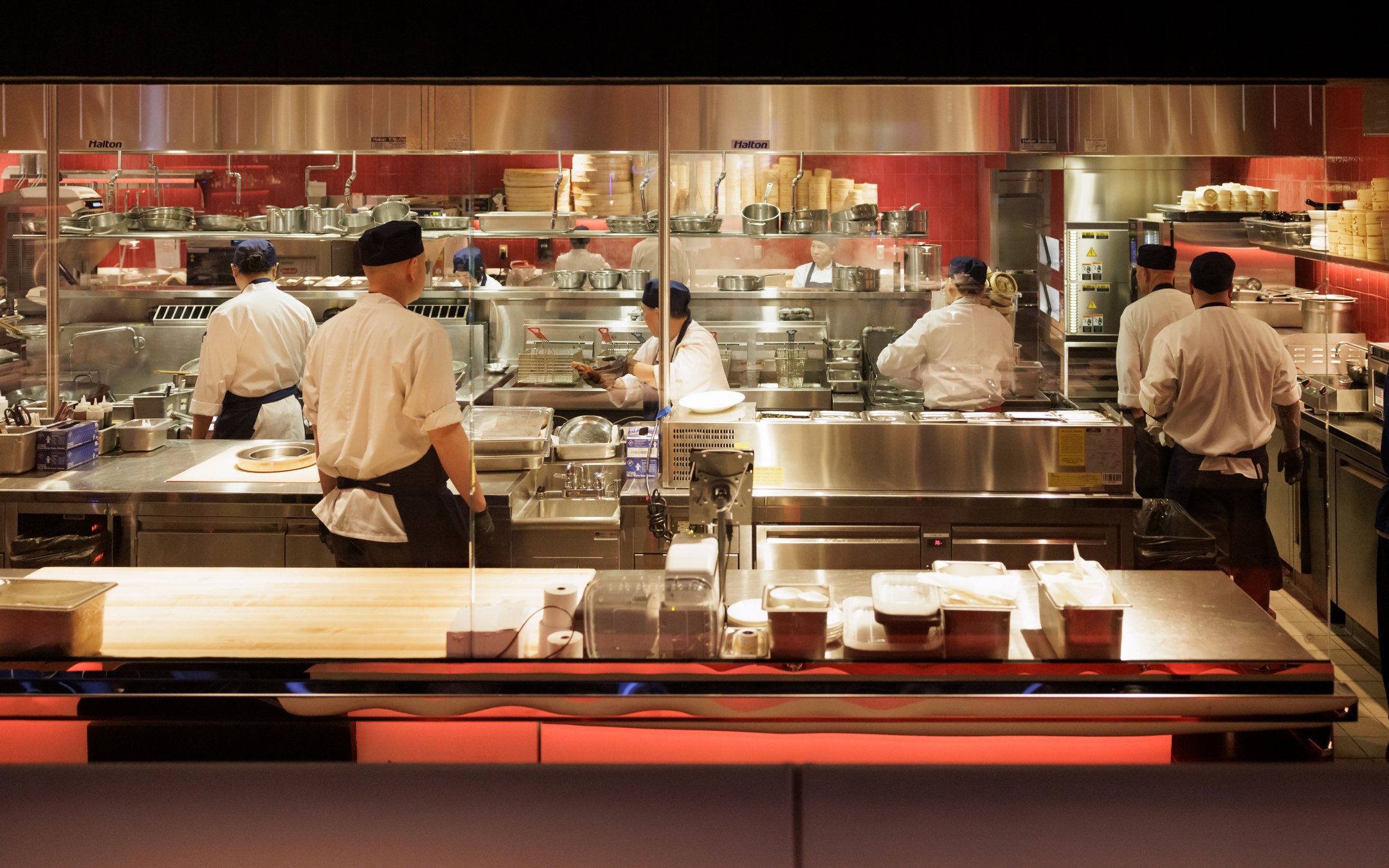 Kitchen with chefs in motion