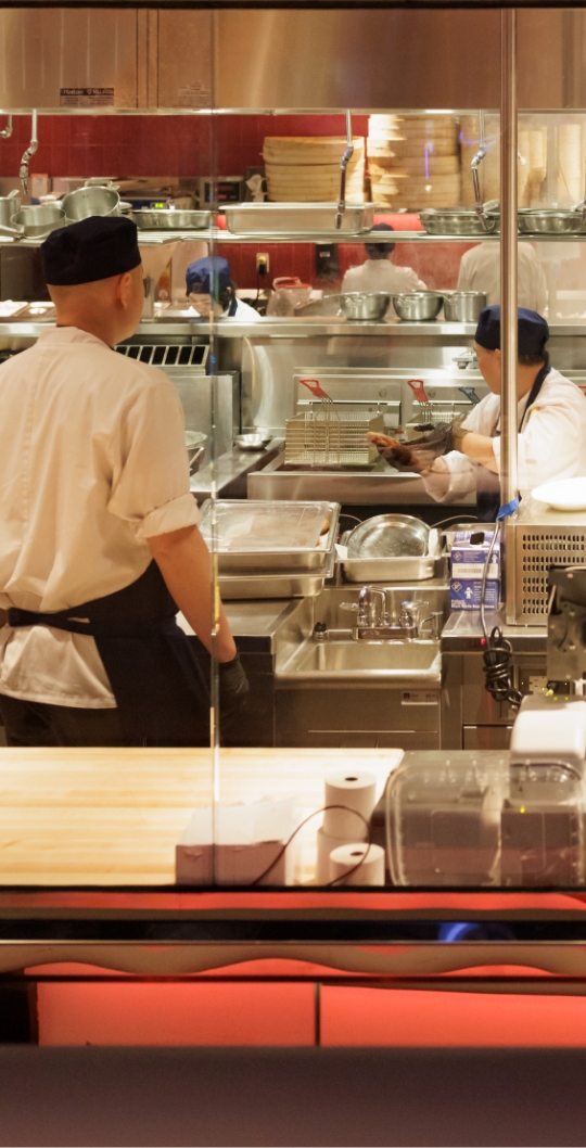 Kitchen with chefs in motion