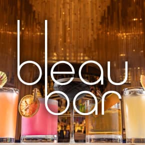 Bleau bar logo over selection of cocktails in varied glasses.