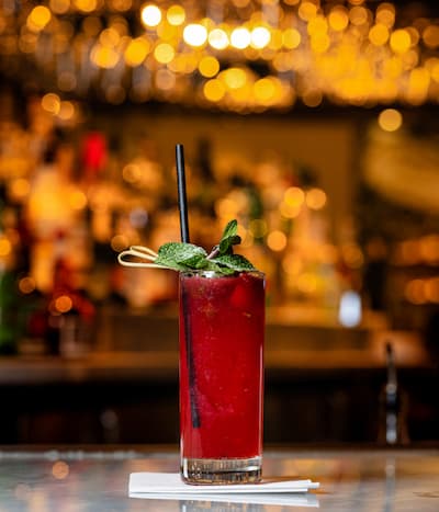 Red cocktail with garnish