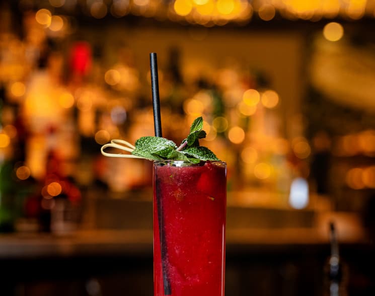 Red cocktail with garnish