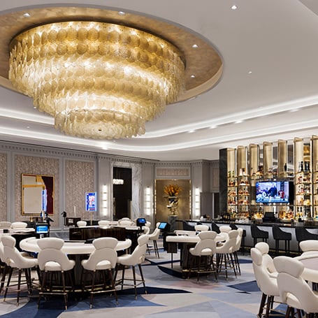 Gambling tables under chandelier in high limit area at Fontainebleau Las Vegas