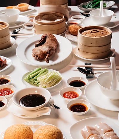 Full table of Asian foods with dipping sauces