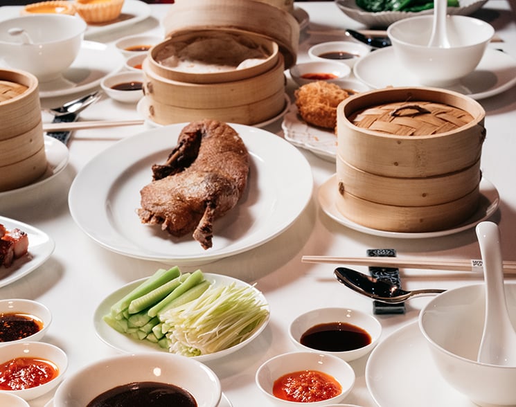 Full table of Asian foods with dipping sauces