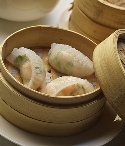 Steamed wontons in wooden container
