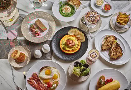 Full plates of food on white table