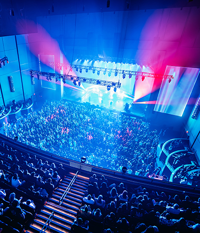 Crowded theater lit from a performance