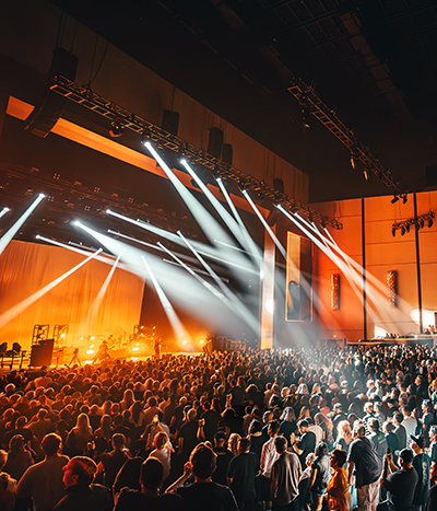Crowded theater lit from a performance