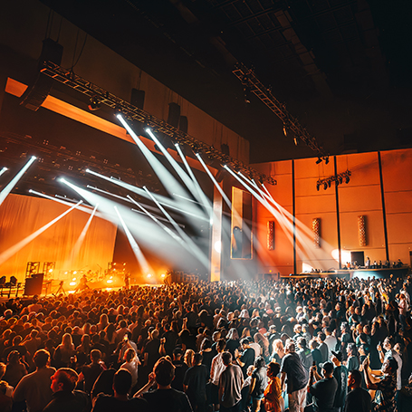 Crowded theater lit from a performance