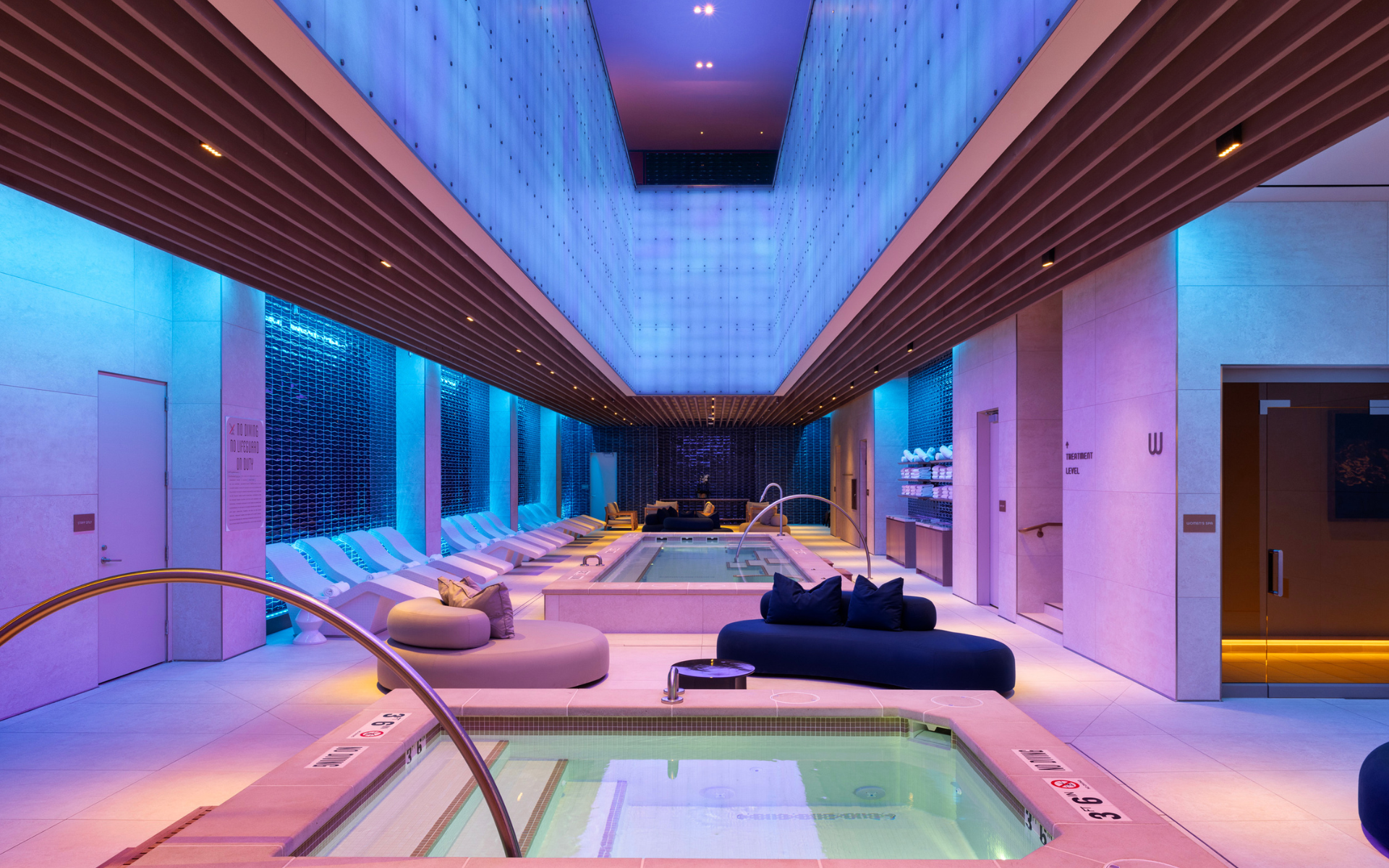 Pool area with seating areas and LED lighting