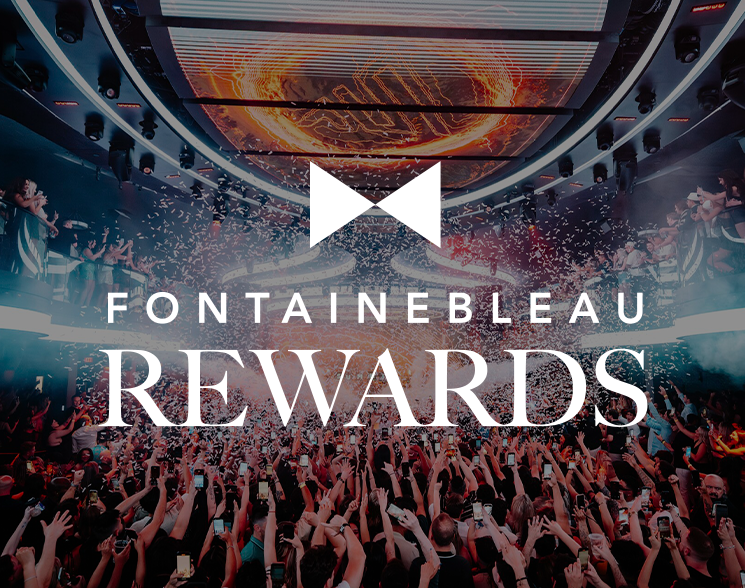 Crowded club with confetti under LED halo under text: Fontainebleau Rewards