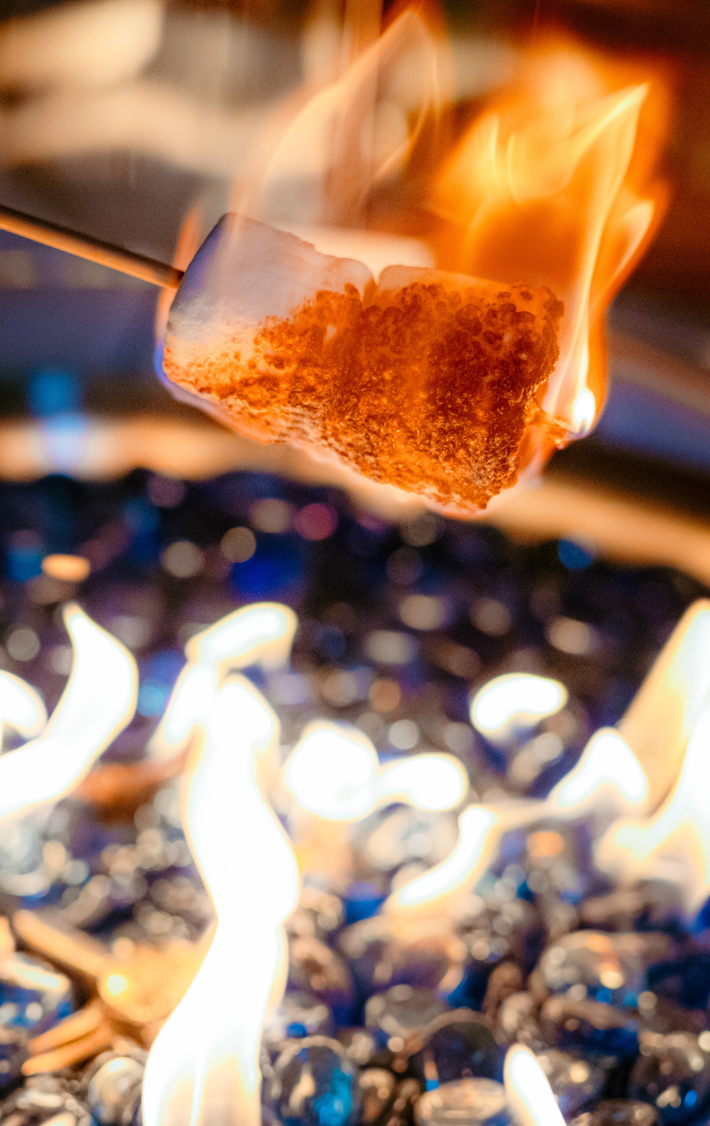 Marshmallow alight over a campfire