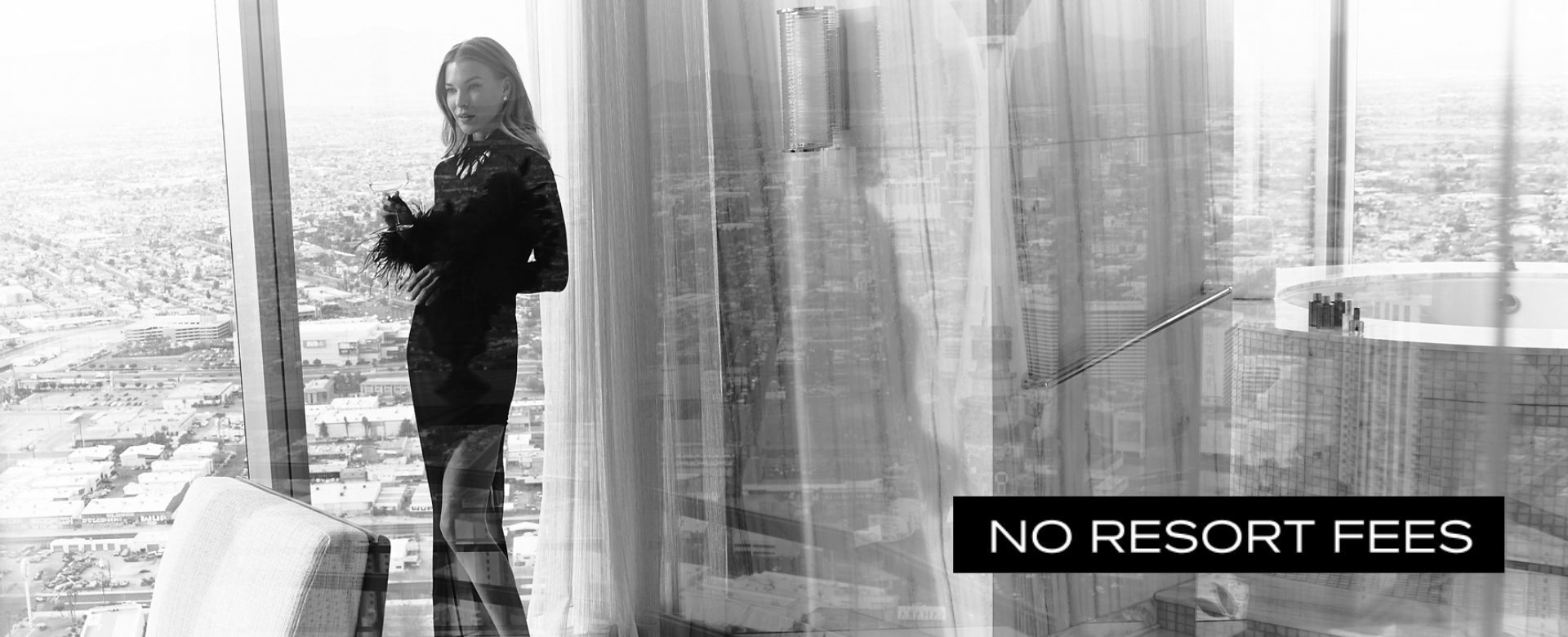 Model in black dress in front of window with black box and white text: No Resort Fees