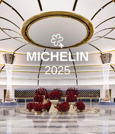 Michelin logo over lobby with rose displays