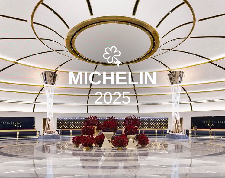 Michelin logo over lobby with rose displays