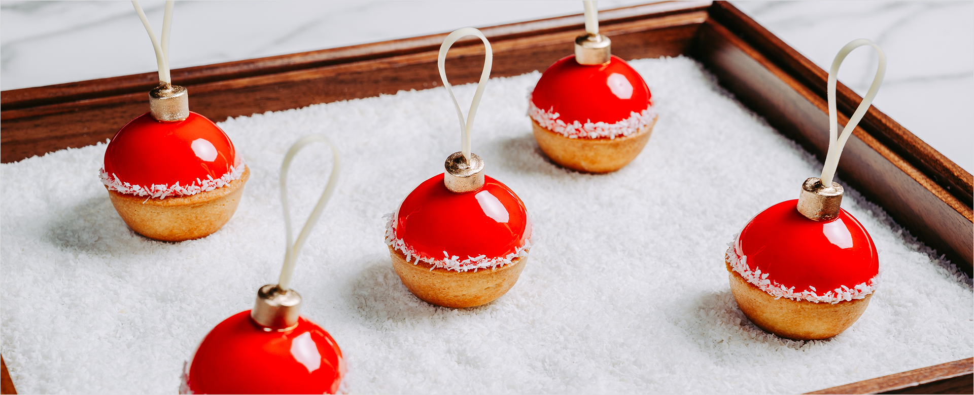 Sweets shaped like ornaments on sugar bed