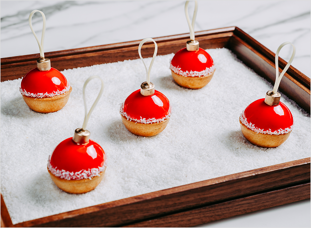 Sweets shaped like ornaments on sugar bed