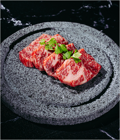Pieces of wagyu on granite plate