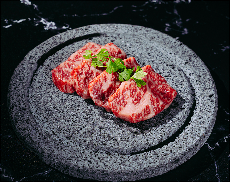 Pieces of wagyu on granite plate