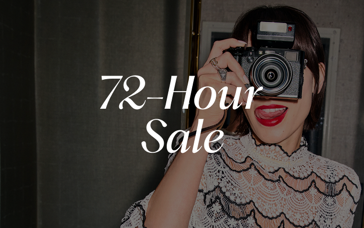 Woman holding a camera with text: 72-Hour Sale